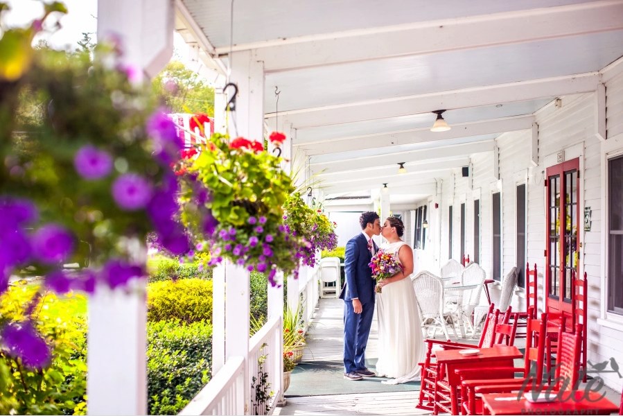 bride-and-groom-at-echo-lake-inn-front-porch-vermont bride-and-groom-at-echo-lake-inn-front-porch-vermont
